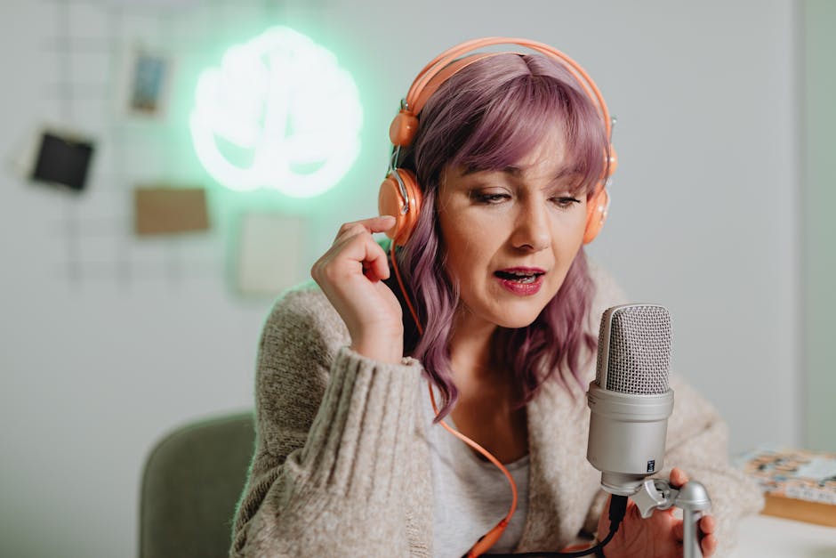 young woman listening to podcast with headphones